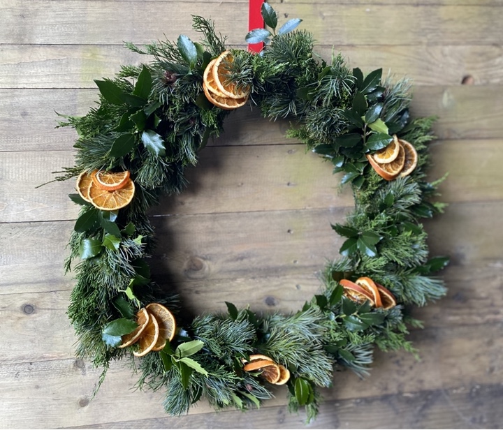 fresh evergreen wreath with dried citrus slices